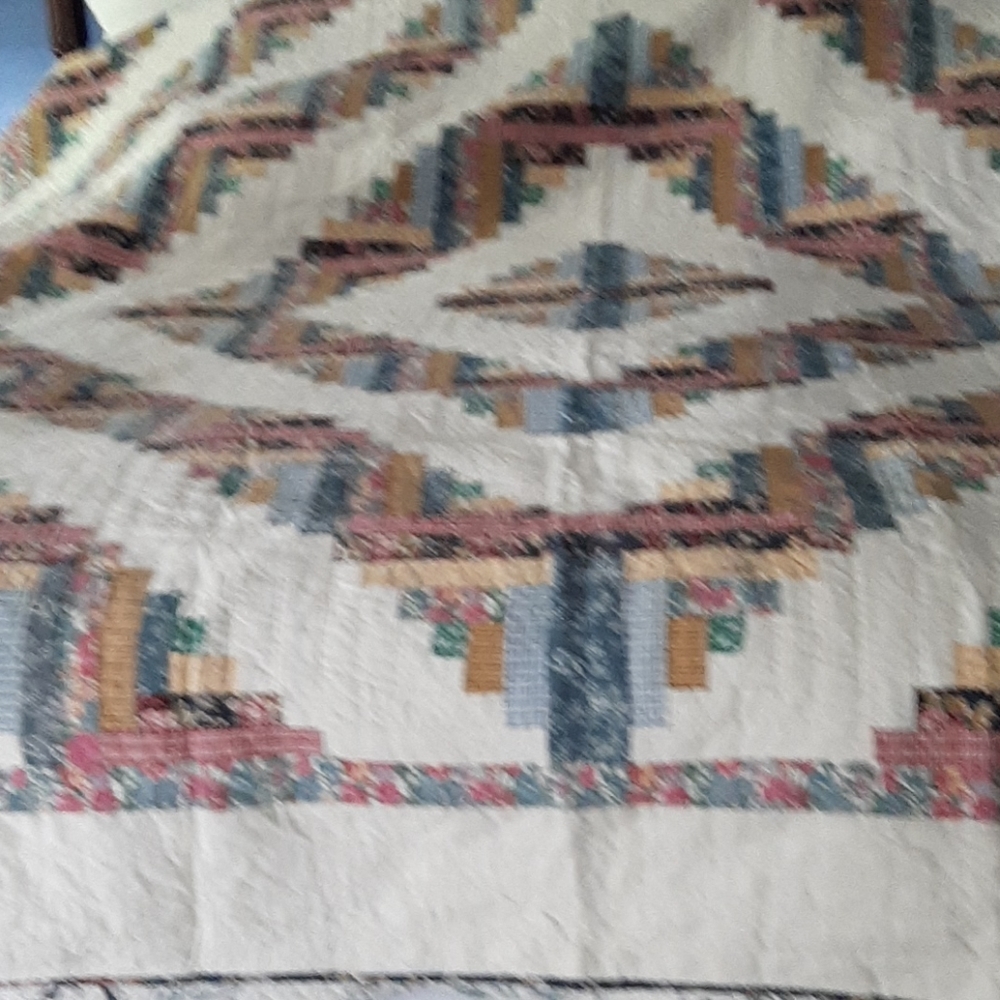 Full size quilted bedspread.